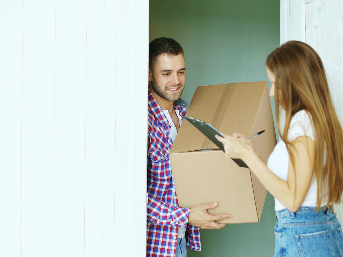 A parcel being handed over at the door