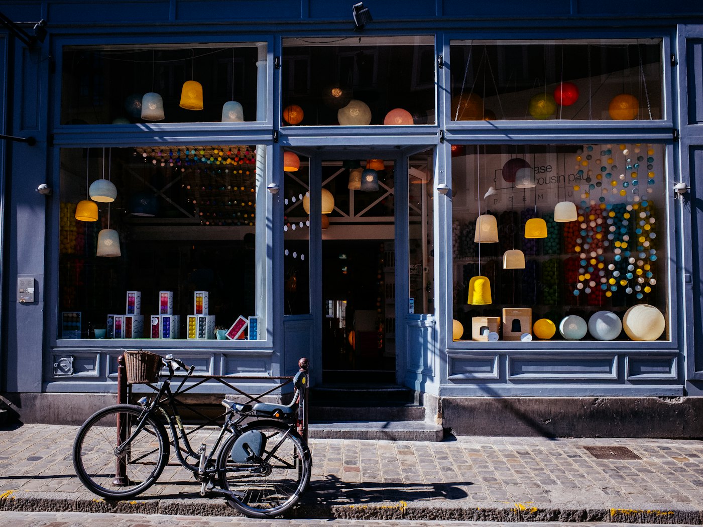 A shopfront with a bicycle parked outside